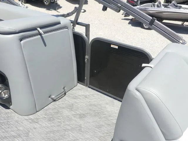 Slide: The Image of The image shows the interior of a 2019 Manitou Encore 25 SR SHP with gray upholstery. - 19