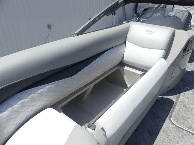 Slide: The Image of The image shows the gray upholstery of a 2019 Manitou Encore 25 SR SHP. - 29