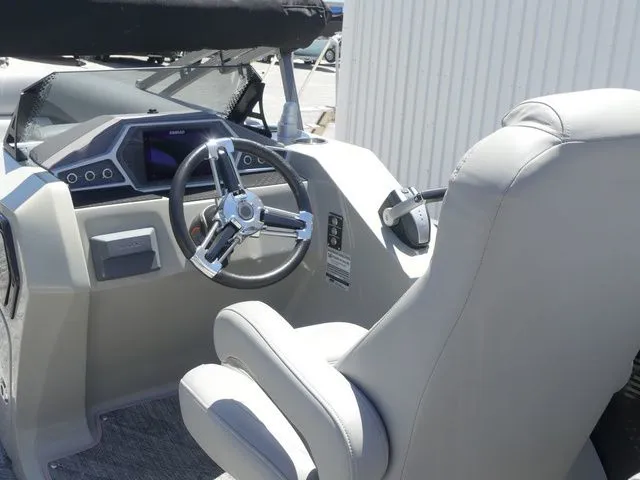 Slide: The Image of The image shows the cockpit of a 2019 Manitou Encore 25 SR SHP with a sleek steering wheel and modern instruments. - 27