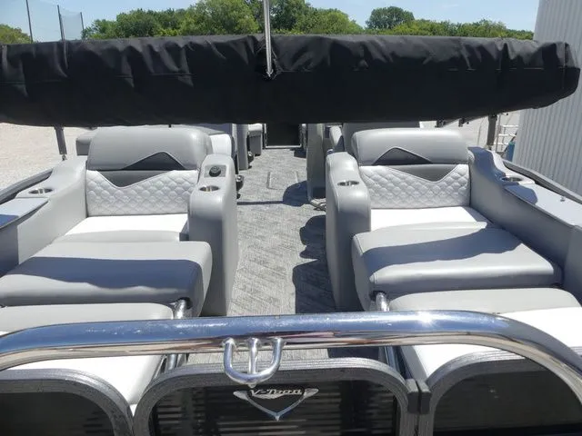 Slide: The Image of The image shows the interior of a 2019 Manitou Encore 25 SR SHP with luxurious seating. - 24