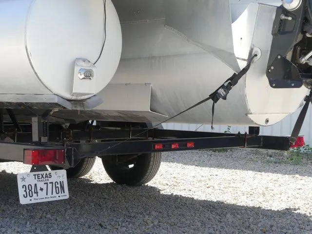 Slide: The Image of A 2019 Manitou Encore 25 SR SHP on a trailer, featuring a Texas license plate. - 10