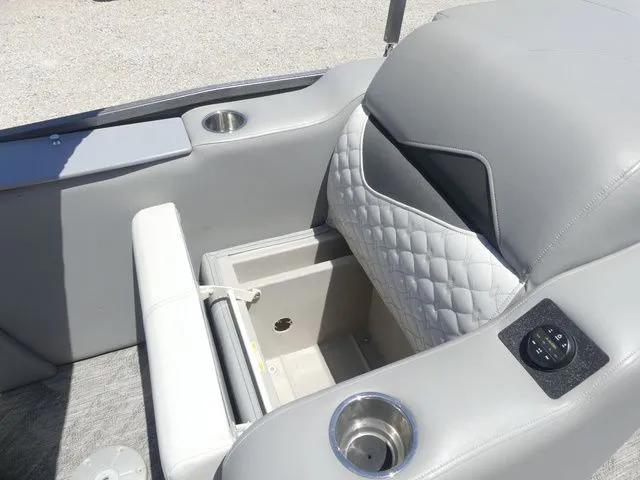 Slide: The Image of Gray upholstery with quilted pattern and cup holders on a boat seat. - 35