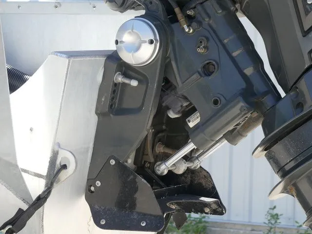 Slide: The Image of Close-up of a boat's outboard motor with visible mechanical components. - 8