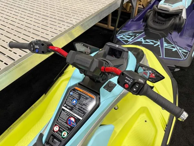 Slide: The Image of A 2025 Yamaha WaveRunner JetBlaster with bright yellow and blue design, red handlebars, and controls. - 3