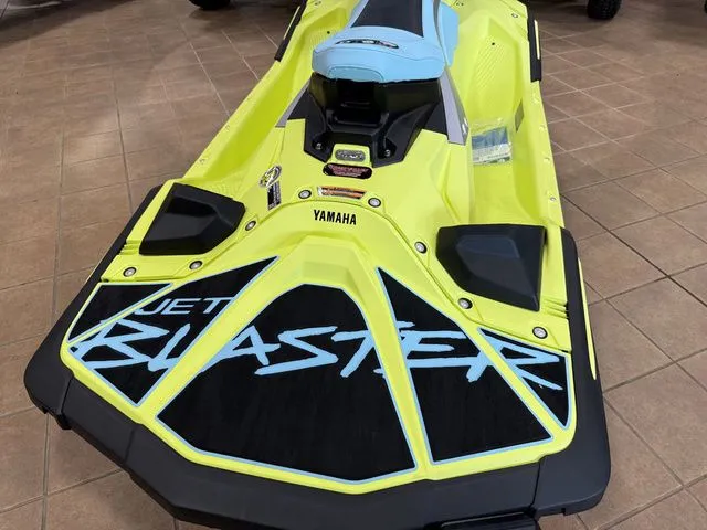 Slide: The Image of A yellow 2025 Yamaha WaveRunner JetBlaster with a sporty design on a tiled floor. - 8