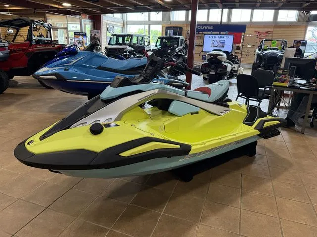 Slide: The Image of A 2025 Yamaha WaveRunner JetBlaster in a showroom. It features a striking yellow and blue design. - 11