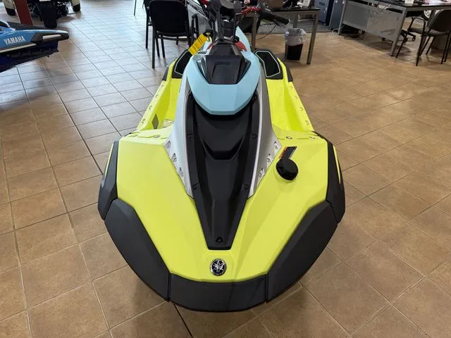 Slide: The Image of A 2025 Yamaha WaveRunner JetBlaster in a showroom. It features a striking yellow and blue design. - 11