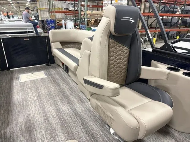 Slide: The Image of The image shows the interior of a 2026 Bennington S Quad Bench 23 SSR with luxurious seating. - 15