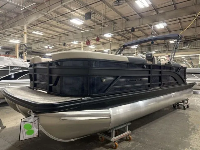 Slide: The Image of A Bennington pontoon boat, model S Quad Bench 23 SSR, year 2026, in a warehouse. - 4