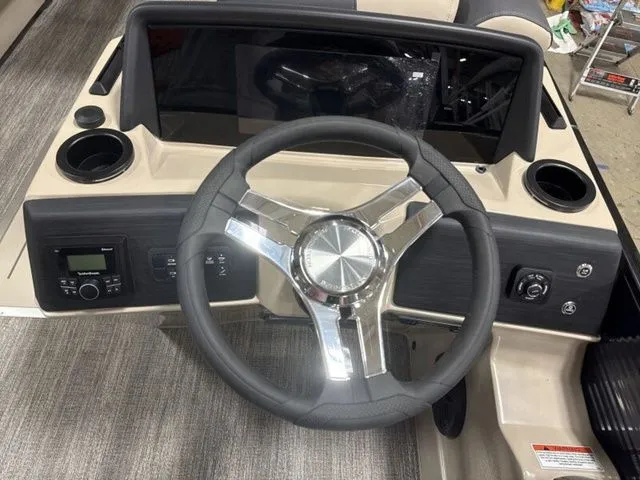 Slide: The Image of The image shows the helm of a 2026 Bennington S Quad Bench 23 SSR. - 13