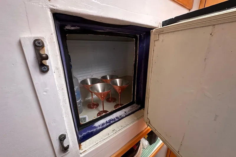 Slide: The Image of Open fridge on 1999 Baltec Engineering Visiona Catamaran with martini glasses inside. - 30