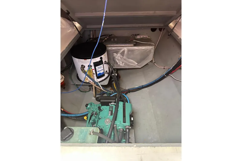 Slide: The Image of Engine compartment of 1999 Baltec Engineering Visiona Catamaran with visible machinery and wiring. - 65