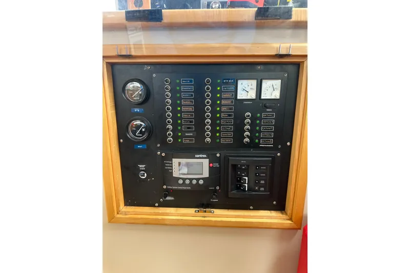 Slide: The Image of Control panel of a 1999 Baltec Engineering Visiona Catamaran with gauges and switches. - 50