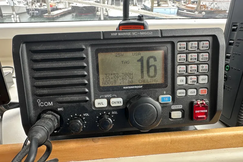 Slide: The Image of VHF marine radio on Baltec Engineering Visiona Catamaran, model year 1999, displaying channel 16. - 47
