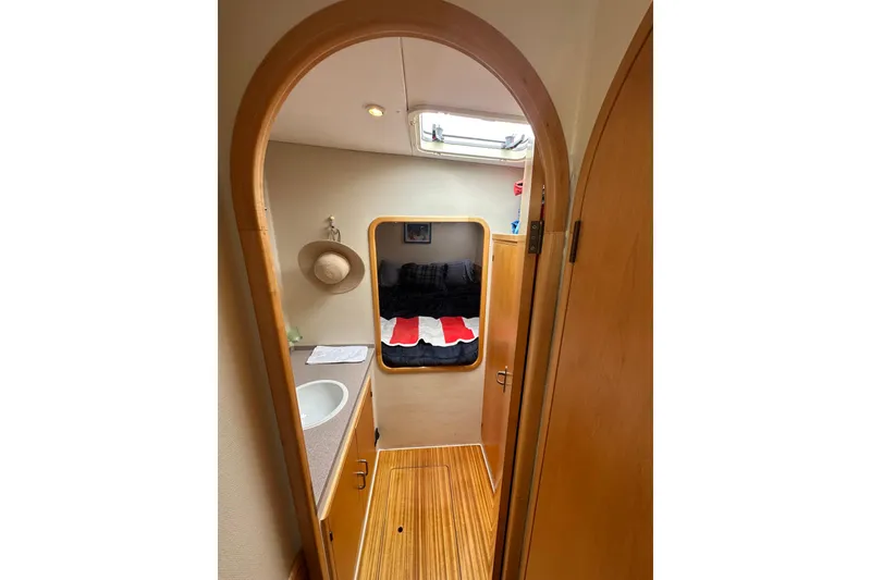 Slide: The Image of Interior of 1999 Baltec Engineering Visiona Catamaran with wooden finishes and cozy cabin. - 33
