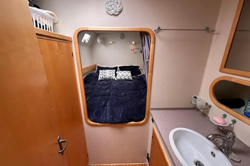 Slide: The Image of Cozy cabin interior of 1999 Baltec Engineering Visiona Catamaran with bed and sink. - 28