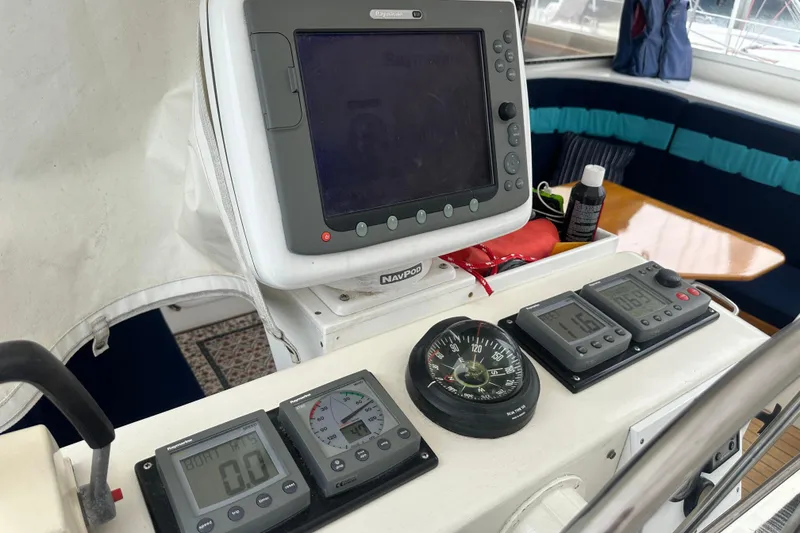 Slide: The Image of Cockpit of 1999 Baltec Engineering Visiona Catamaran with navigation instruments and compass. - 40