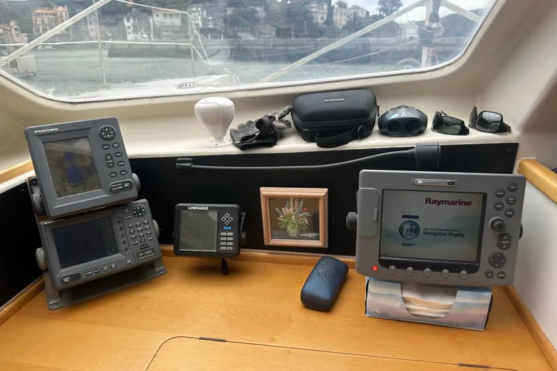 Slide: The Image of Navigation equipment inside a 1999 Baltec Engineering Visiona Catamaran, featuring Raymarine and Furuno displays. - 46