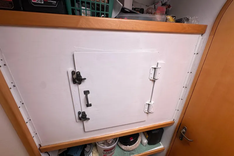 Slide: The Image of Storage compartment on a 1999 Baltec Engineering Visiona Catamaran with secure latch and shelving. - 26