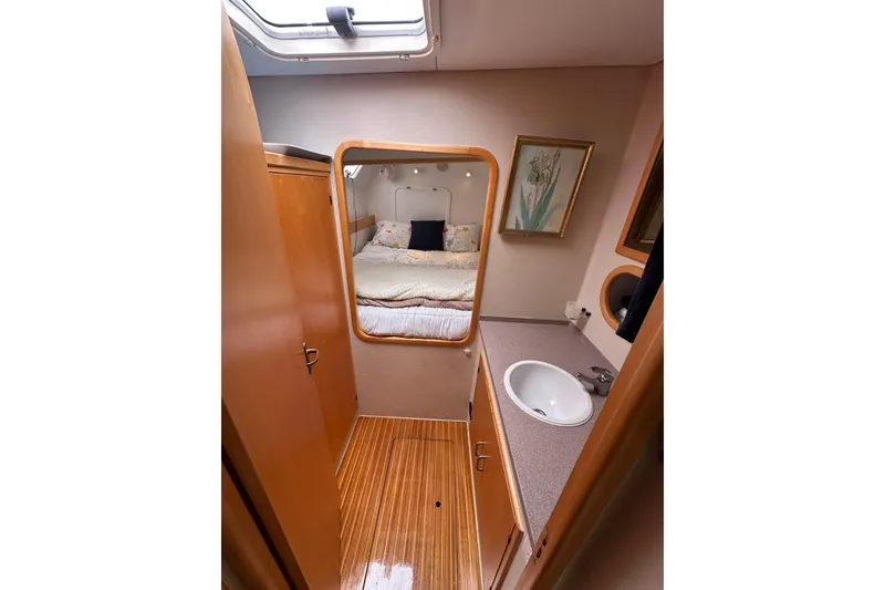 Slide: The Image of Interior of 1999 Baltec Engineering Visiona Catamaran with cozy bedroom and compact bathroom. - 36