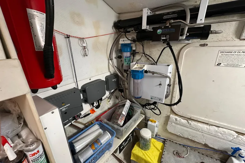 Slide: The Image of Engine room of a 1999 Baltec Engineering Visiona Catamaran with equipment and fire extinguisher. - 58