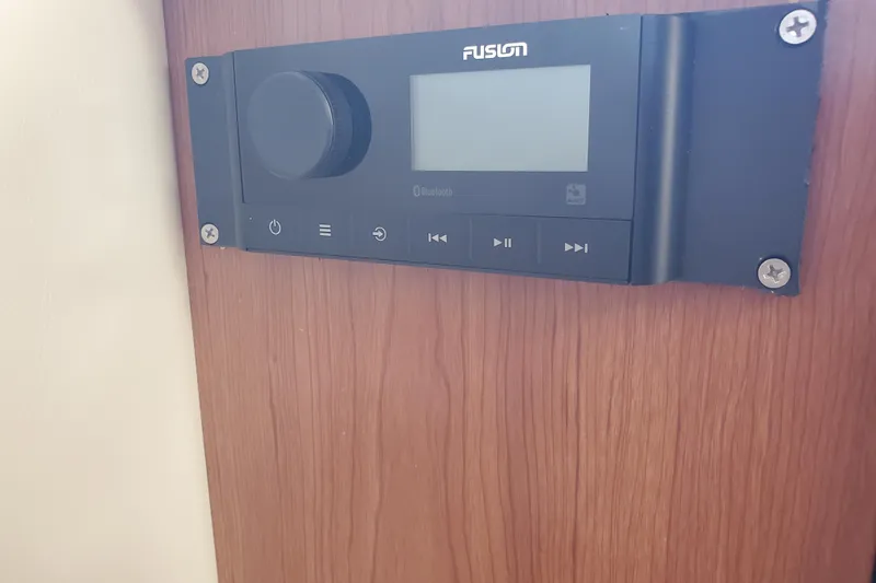 Slide: The Image of Fusion audio system on 2004 Bayliner 285 boat, mounted on wooden panel. - 7