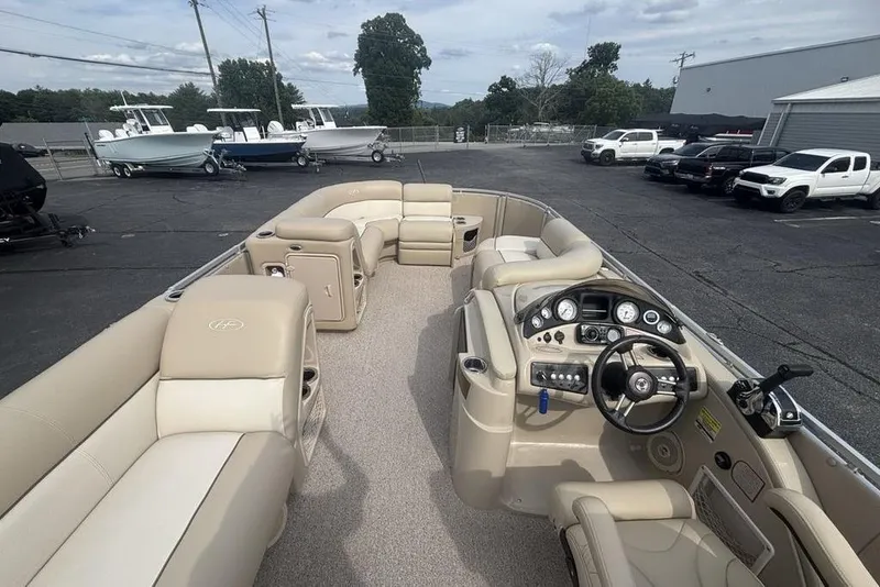 Slide: The Image of 2011 Harris Royal Heritage 260 I/O pontoon boat with spacious seating and modern dashboard. - 20