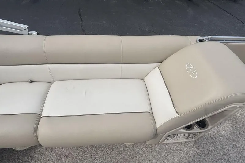 Slide: The Image of Beige seating on 2011 Harris Royal Heritage 260 I/O boat, featuring cup holders and storage. - 11