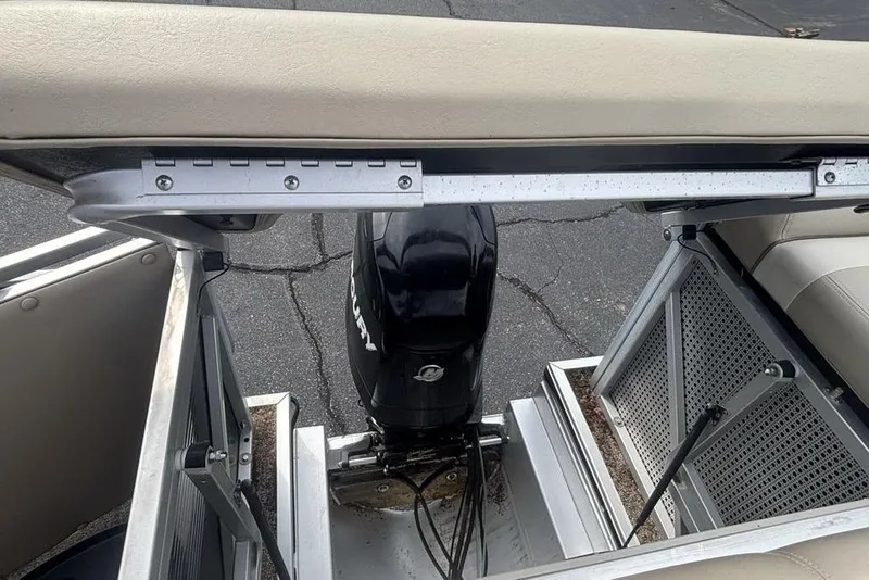 Slide: The Image of 2011 Harris Royal Heritage 260 I/O boat engine area with Mercury motor. - 18