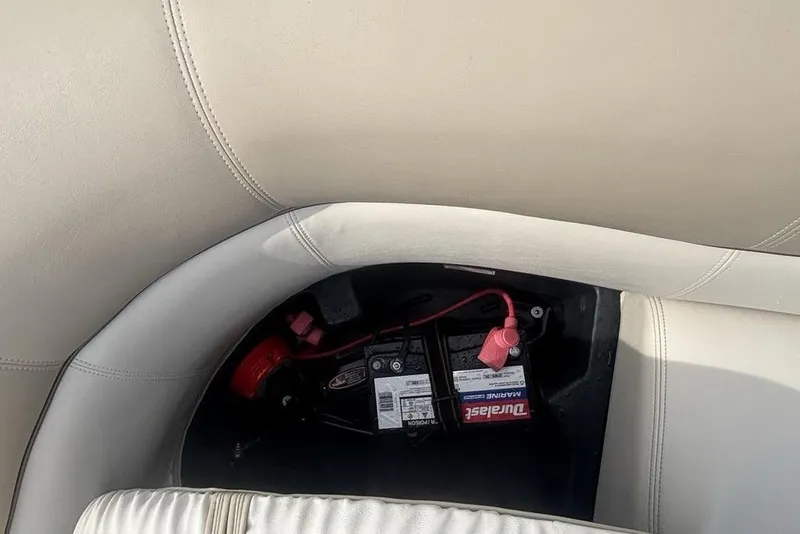 Slide: The Image of Battery compartment of a 2011 Harris Royal Heritage 260 I/O boat with marine battery. - 16