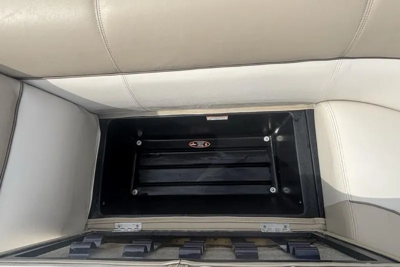 Slide: The Image of Open storage compartment in 2011 Harris Royal Heritage 260 I/O boat seat. - 5