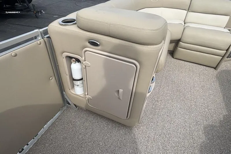 Slide: The Image of Interior of 2011 Harris Royal Heritage 260 I/O boat with beige seating and fire extinguisher. - 21