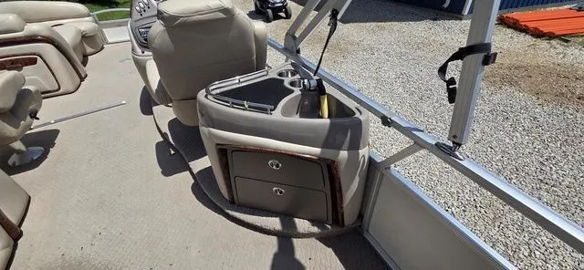 Slide: The Image of Interior of a 2008 Tracker Regency Party Barge with beige seating and storage compartments. - 7