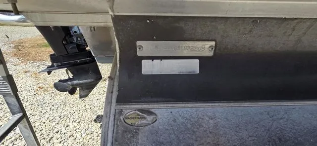 Slide: The Image of Close-up of a 2008 Tracker Regency Party Barge with serial number plate and motor. - 17