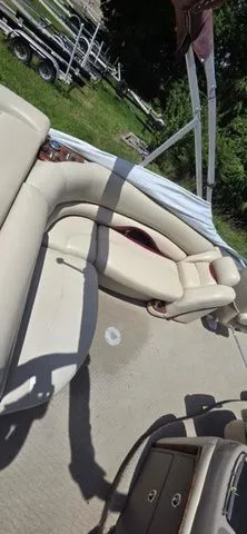 Slide: The Image of A 2008 Tracker Regency Party Barge with beige upholstery and a sunshade. - 14