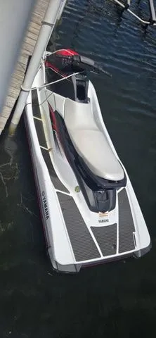 Slide: The Image of A white 2019 Yamaha WaveRunner EX jet ski is docked in the water. - 6