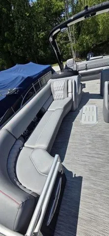Slide: The Image of The image shows the deck of a 2020 Bennington 25 RXSBA with gray upholstery. - 10