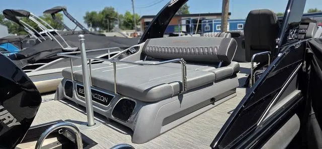 Slide: The Image of The image shows the stern of a 2020 Bennington 25 RXSBA with gray upholstery. - 7