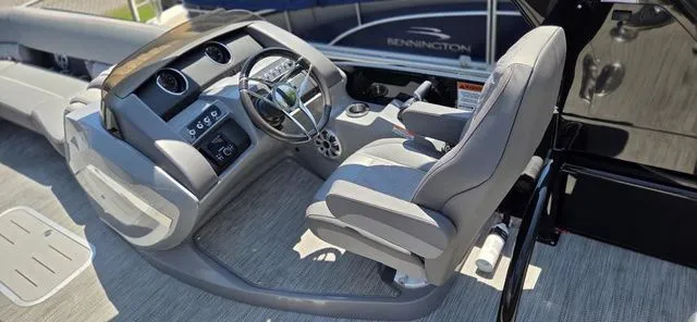 Slide: The Image of The image shows the cockpit of a 2020 Bennington 25 RXSBA with a modern helm station. - 5