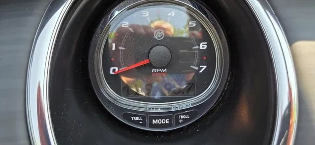 Slide: The Image of Close-up of a tachometer with a scale from 0 to 7. Displays 3,000 RPM. - 21