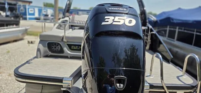 Slide: The Image of A 2020 Bennington 25 RXSBA with a 350 HP Verado engine, parked at a boatyard. - 13