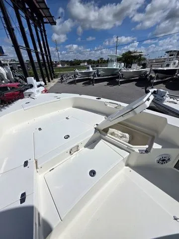 Slide: The Image of The image shows the deck of a 2023 Pathfinder 2400 TRS boat with storage and seating areas. - 16