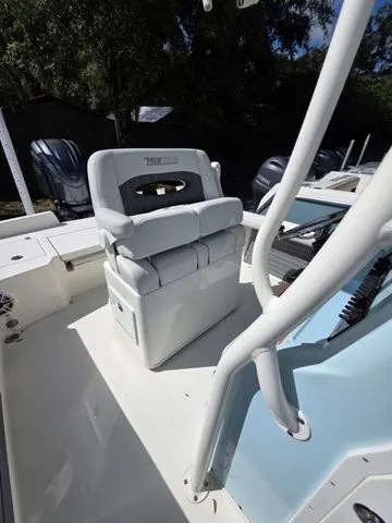 Slide: The Image of The image shows the helm of a 2023 Pathfinder 2400 TRS with a cushioned seat. - 8
