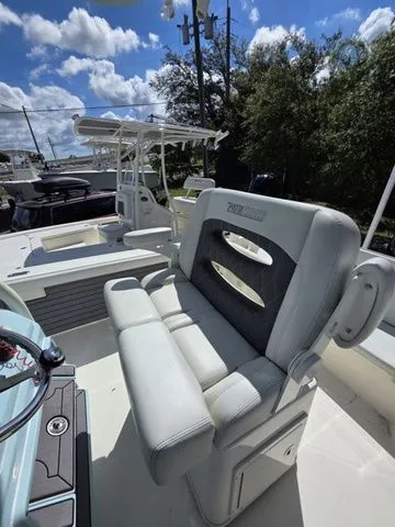 Slide: The Image of The image shows the cockpit of a 2023 Pathfinder 2400 TRS with cushioned seating and helm console. - 12