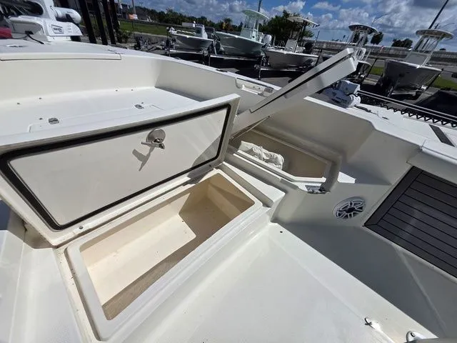 Slide: The Image of The image shows the deck of a 2023 Pathfinder 2400 TRS boat with storage compartments. - 17