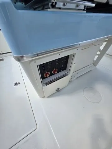 Slide: The Image of Close-up of a boat control panel with blue and white surfaces. - 15