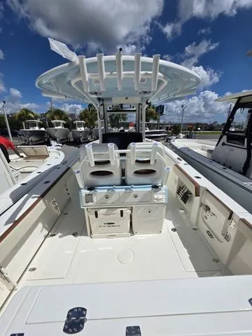 Slide: The Image of The image shows a 2027 Cobia 265CC boat with a spacious deck and two seats. - 4
