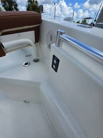 Slide: The Image of Close-up of a boat deck with stainless steel railing and brown upholstery. - 27