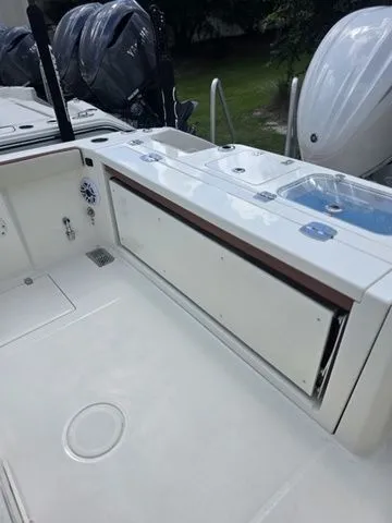 Slide: The Image of The image shows the deck of a Cobia 265CC boat with modern features. - 7