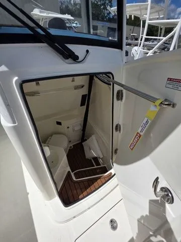 Slide: The Image of Cobia 265CC 2027: Cabin with wood flooring and storage space. - 24